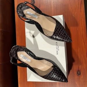 Sling back low heel crock pattern shoes.